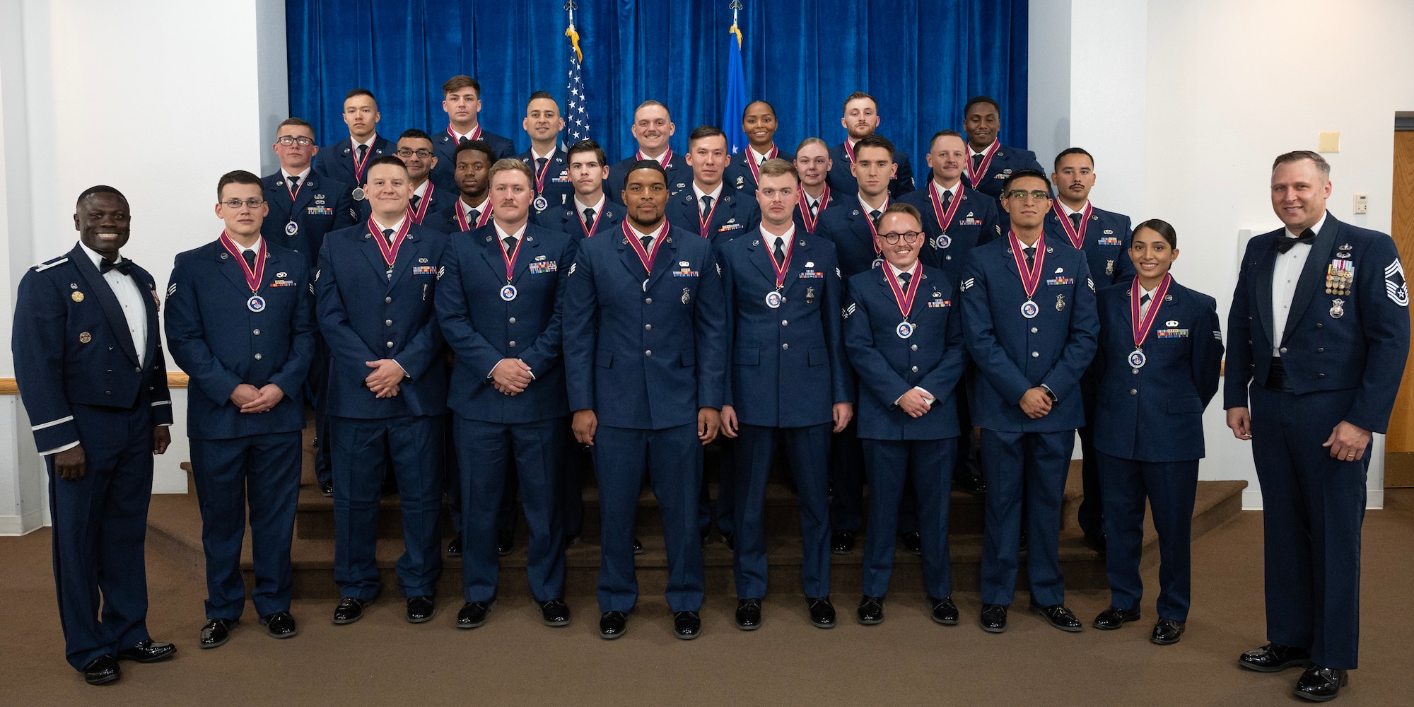 group photo of Airman Leadership School graduates with leadership