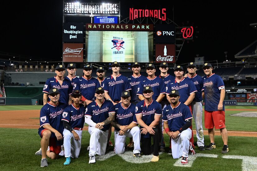 Joint Base Andrews softball team group photo on the pitch of Nationals Park.