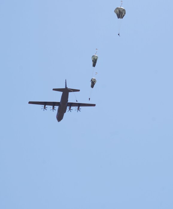 A U.S. Air Force C-130J assigned to the 115th Airlift Squadron air drops members of the Army’s 346th Theatre Aerial Delivery Company during an exercise at a drop zone on Fort Hunter Liggett, California, September 9, 2023. Utilizing the C-130J, the 146th Airlift Wing partnered with the army to accomplish skill-enhancing training and provide airlift support to the wing's evaluated exercise. The exercise, also known as Crisis Beach II, was a multi-day exercise to evaluate the 146th Airlift Wing's ability to deploy, adapt, and survive in a contested environment. Airmen participating implemented many skill sets shared from other career fields to demonstrate their ability to execute the Agile Combat Employment (ACE) model, highlighting their proactive and reactive operational strategies under simulated threat timelines in order to increase survivability while generating combat power. (U.S. Air National Guard photo by Staff Sgt. Michelle Ulber)