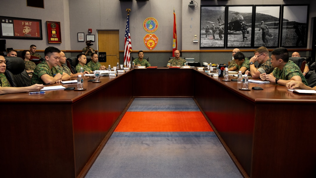 Pacific Marines and Sailors with U.S. Marine Corps Forces, Pacific, and soldiers with the Singapore Army participate in the first MARFORPAC-Singapore Army Staff Talks at MARFORPAC, Camp H.M. Smith, Hawaii, Sept. 21, 2023. The two-day talks established a forum to improve coordination of bilateral exercises and operations while discussing areas of interest throughout the Indo-Pacific. (U.S. Marine Corps photo by Lance Cpl. Blake Gonter)