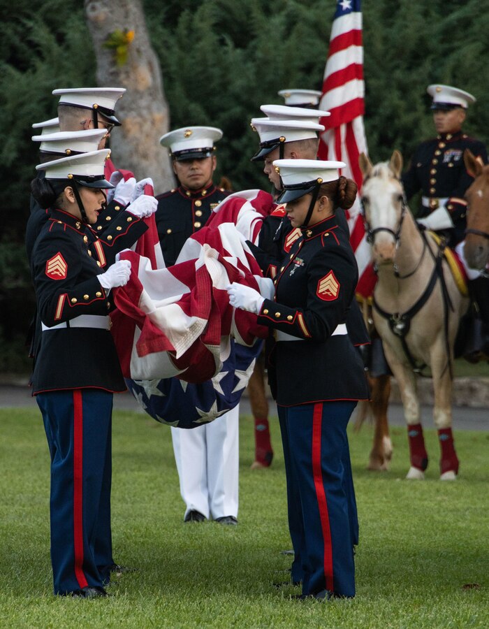 U.S. Marines with Headquarters and Support Battalion, Marine Corps Base Camp Pendleton, fold the U.S. flag during the 81st annual Evening Colors Ceremony at the Santa Margarita Ranch House on MCB Camp Pendleton, California, Sept. 20, 2023. The annual ceremony is held to recognize the base’s history, legacy, importance and the commemoration of the official dedication of Camp Pendleton. President Franklin D. Roosevelt dedicated the installation Sept. 25, 1942, in honor of World War I Maj. Gen. Joseph H. Pendleton, who had long advocated the establishment of a West Coast training base. (U.S. Marine Corps photo by Lance Cpl. Mary Jenni)