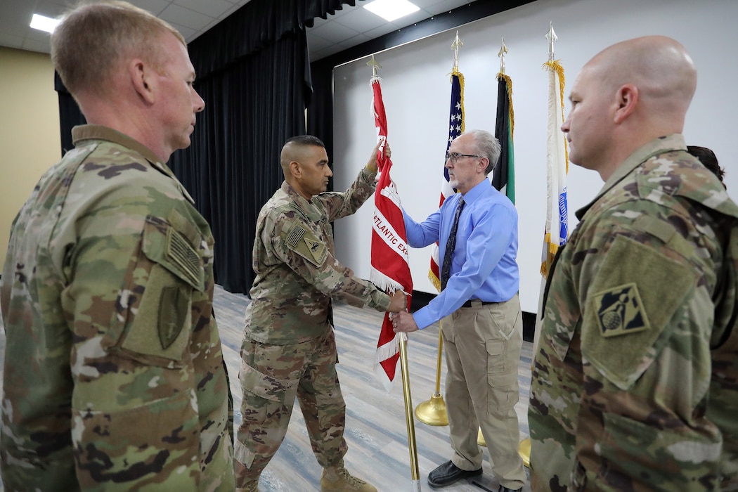The U.S. Army Corps of Engineers only forward-deployed district welcomed its newest commander here July 6 as the district continues its pursuit of engineering excellence in the Central Command area of responsibility. The reins to the caravan, as the district is known colloquially, were passed to Col. Mohammed Rahman by outgoing district commander, Lt. Col. Richard Childers during a ceremony officiated by Transatlantic Division Commander Col. William Hannan and attended by local leadership, the district workforce and Kuwait Ministry of Defense partners.