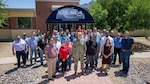 White Sands Detachment personnel and Naval Surface Warfare Center, Port Hueneme Division leaders gather outside of the detachment’s headquarters at White Sands Missile Range in New Mexico on May 24. The White Sands team specializes in testing naval weapons and launching rockets for scientific research. (U.S. Navy photo by Eric Parsons/Released)