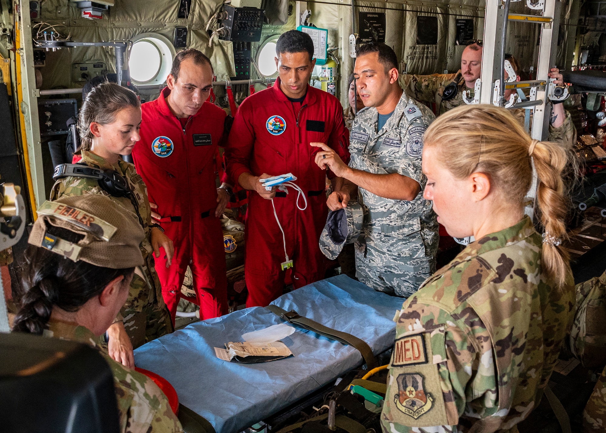 From right, U.S. Air Force Capt. Margaret Stein, Flight Nurse, Maj. Anastasia Fiehler, Mission Clinical Coordinator, and Capt. Courtney Shockley, Flight Nurse assigned to the 405th Expeditionary Aeromedical Evacuation Squadron at the 386th Air Expeditionary Wing, instruct Egyptian military members on the proper use of an automated external defibrillator in support of exercise Bright Star 23, Sept. 10, 2023.