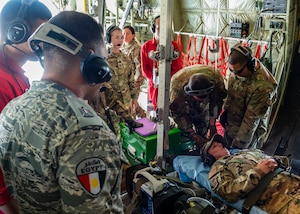 U.S. Air Force Tech. Sgt. Bobby Goldsby, Aeromedical Evacuation Technician, and Capt. Courtney Shockley, Flight Nurse, assigned to the 405th Expeditionary Aeromedical Evacuation Squadron at the 386th Air Expeditionary Wing, speak with Egyptian military members onboard a C-130J Super Hercules in Egypt in support of exercise Bright Star 23, Sept. 10, 2023.