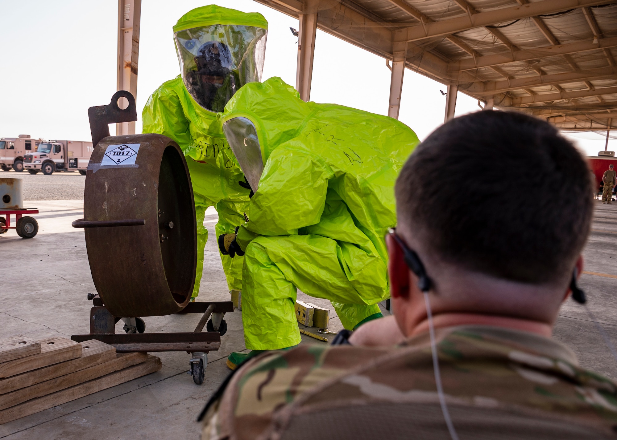 Members from the 386th Expeditionary Civil Engineer Squadron's Fire Department conduct reconnaissance on a simulated chemical spill during a department-wide hazardous material training, at Ali Al Salem Air Base, Kuwait, Sept. 18, 2023.