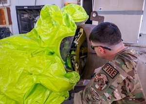 A U.S. Air Force firefighter from the 386th Expeditionary Civil Engineer Squadron removes the M50 gas mask during a department-wide hazardous material training, at Ali Al Salem Air Base, Kuwait, Sept. 18, 2023.