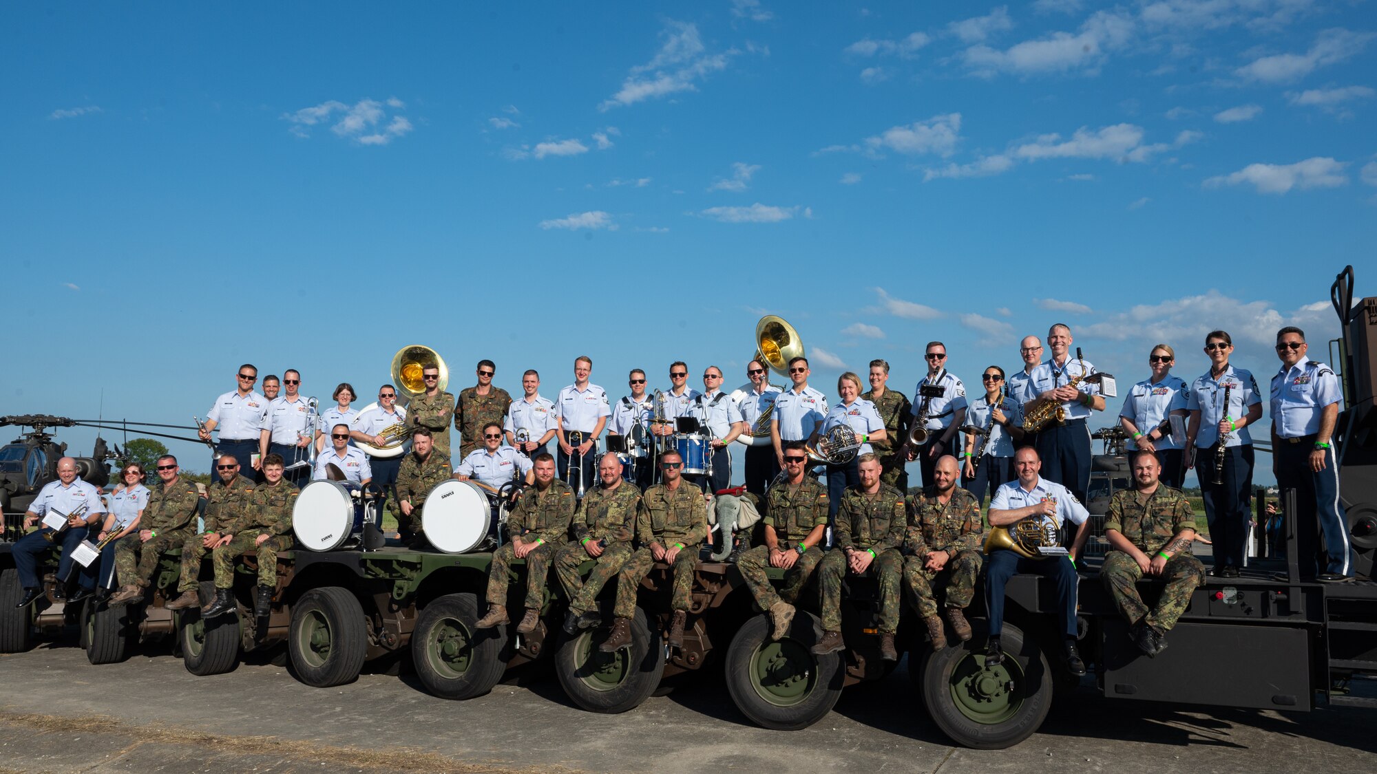 U.S. Air Force Airmen assigned to the U.S. Air Forces in Europe Ceremonial Band, and German armed forces personnel, pose for a group photo during the NATO Days event at Leoš Janáček Airport in Ostrava, Czech Republic, Sept. 16, 2023.