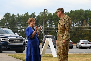 Arkansas state Sen. Jane English, left, speaks with Col. Denny Davies, 19 Airlift Wing and installation commander, right.