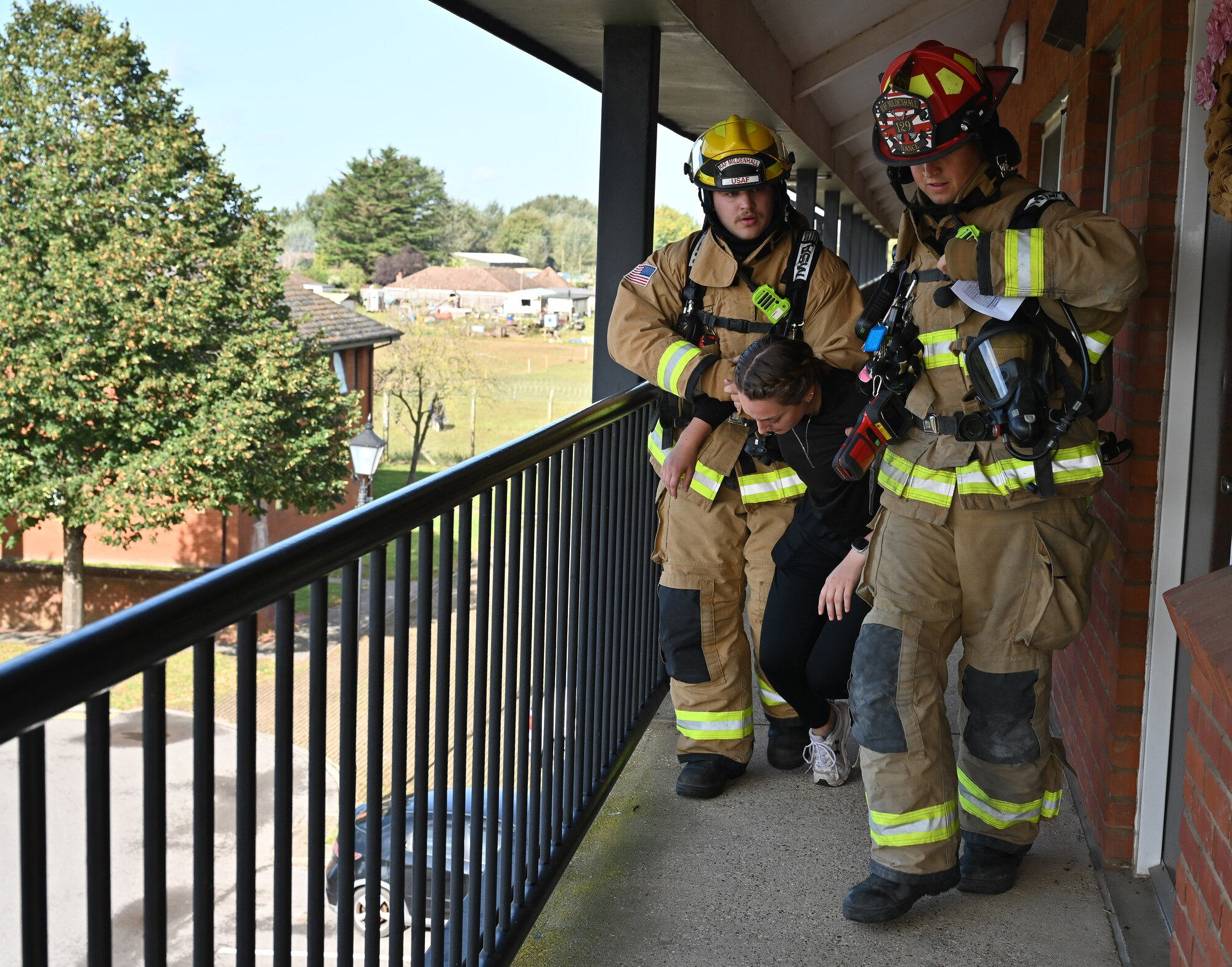 U.S. Air Force Staff Sgt. Connor Nance, right, and Airman 1st Class Adam Bode, both 100th Civil Engineer Squadron Fire Department firefighters, perform search and rescue during a natural disaster mass care exercise at Royal Air Force Mildenhall, England, Sept. 21, 2023. The exercise allowed firefighters and 100th Security Forces Squadron defenders to practice performing essential operations during a simulated natural disaster incident. (U.S. Air Force photo by Karen Abeyasekere)