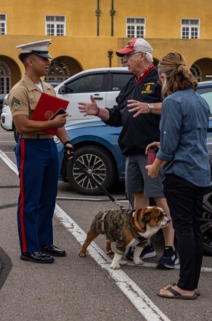 U.S. Marine Corps Cpl. Joshua Dreher, a combat graphics specialist with Marine Corps Recruit Depot San Diego, speaks to a family in attendance after Pfc. Bruno's promotion, Friday Sept. 22, 2023. Pfc. Bruno was named in commemoration of Maj. Gen. Bruno Hochmuth, who at the time of his death was the first general officer killed during the Vietnam War. (U.S. Marine Corps photo by Sgt. Jesse K. Carter-Powell)