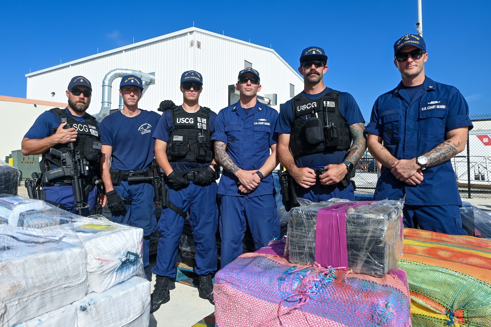 Bales of illegal narcotics, worth an estimated $160 million, are offloaded onto pallets by the U.S. Coast Guard Cutter Confidence (WMEC 619) crew, Sept. 19, 2023, at Coast Guard Base Miami Beach, Florida. Coast Guard and partner agency crews interdicted the illegal narcotics during nine separate cases in the international waters of the Caribbean Sea. (U.S. Coast Guard photo by Petty Officer 3rd Class Santiago Gomez)