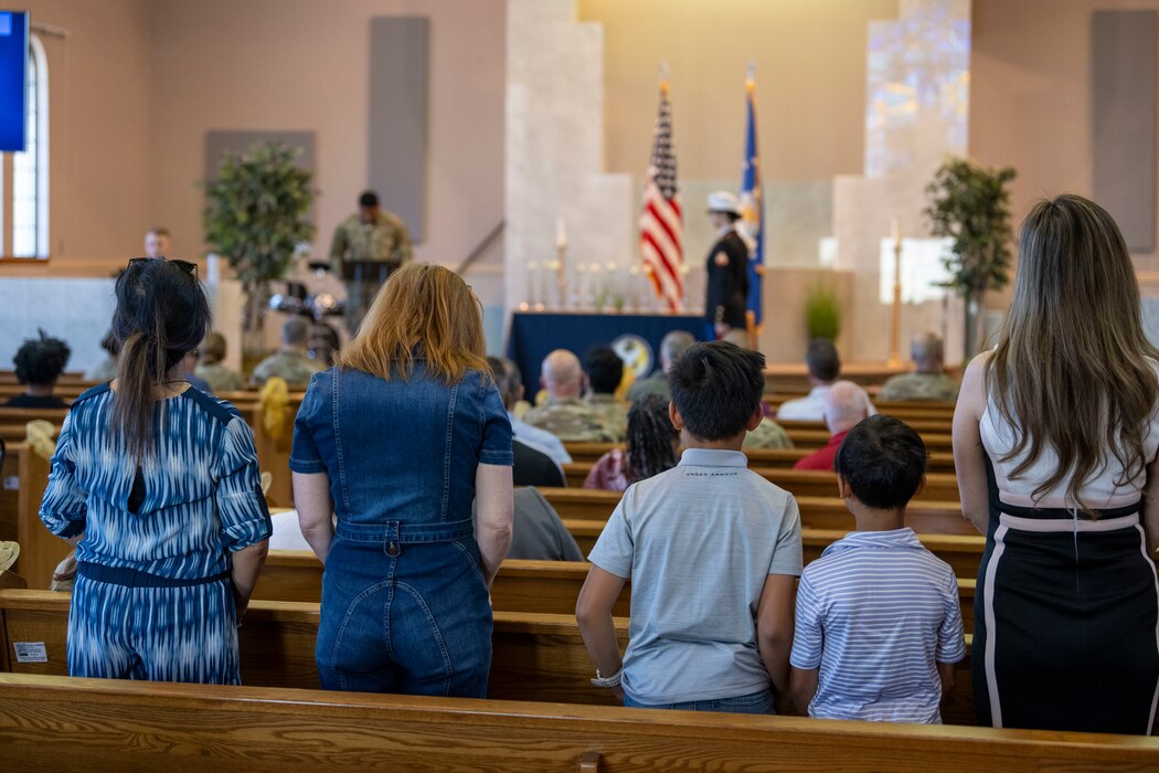 A family stands in a church.