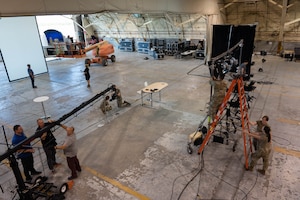 Video people working in an aircraft hangar