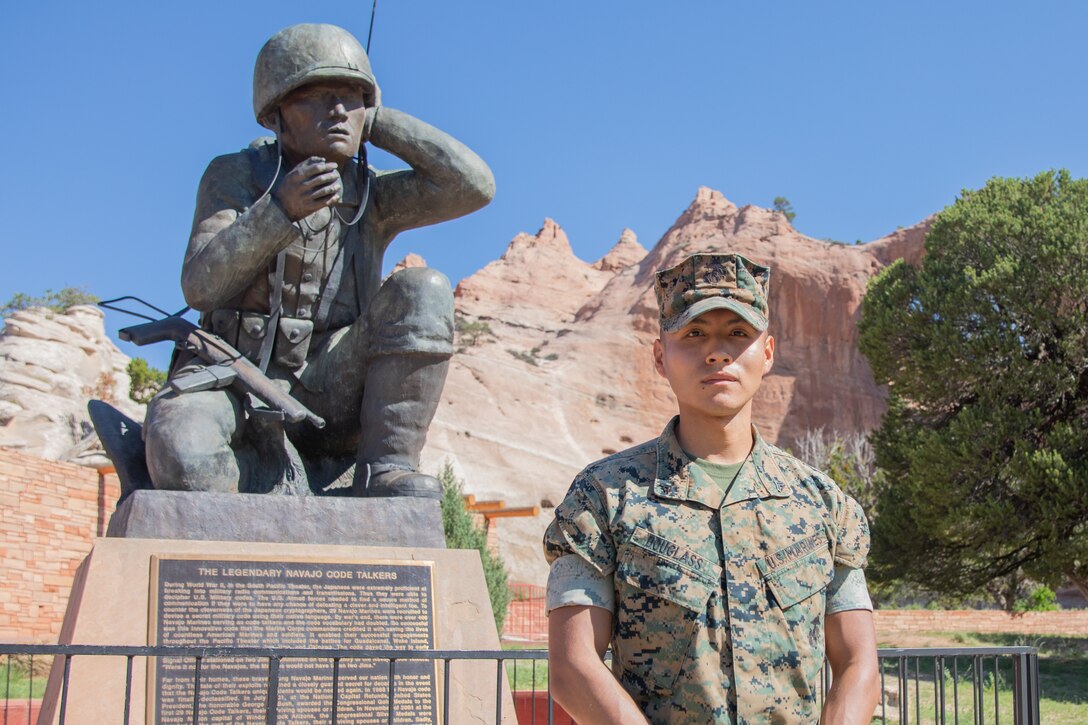 Cpl. Stephen Douglass, a military police officer with Company A, 4th Law Enforcement Battalion, Force Headquarters Group, poses for a photo in front of the Navajo Code Talkers Memorial in Window Rock, Ariz., Aug. 13, 2022. Cpl. Douglass was born and raised on the Navajo Nation reservation and is a proud 4th generation Marine. As a member of the Selected Marine Corps Reserve, he is a full-time student at the University of Kentucky. (U.S. Marine Corps photo by Lance Cpl. Leslie Alcaraz)