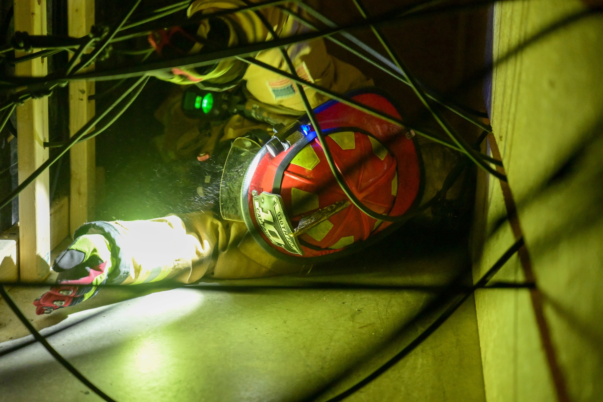 Col. Greg Meyer, 910th Mission Support Group commander, navigates a portion of a confined spaces obstacle course at Youngstown Air Reserve Station, Ohio, Sept. 21, 2023.