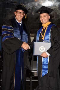 air force master sergeant receives master degree from college
