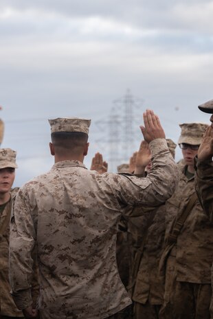 U.S. Marine Corps Capt. Christopher M. Guerra, company commander, with Bravo Company, 1st Recruit Training Battalion, swears in Marines during the Eagle Globe and Anchor ceremony at Marine Corps Base Camp Pendleton, Sept. 20, 2023. After completing the 54-hour culminating event, recruits are given their Eagle, Globe, and Anchors, earning them the title “United States Marine.” Guerra is a native of Saint Angelo, Texas. (U.S. Marine Corps photo by Lance Cpl. Janell B. Alvarez)