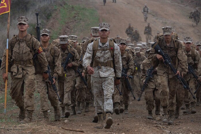 U.S. Marine Corps Staff Sgt. Eugene Galvan, drill instructor with Bravo Company, 1st Recruit Training Battalion, concludes the crucible hike with his platoon at Marine Corps Base Camp Pendleton, Calif., Sept. 20, 2023. The Crucible is a 54-hour long culminating event during recruit training that finalizes the transformation from recruit to Marine. (U.S. Marine Corps photo by Lance Cpl. Janell B. Alvarez)