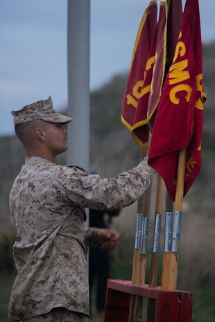 U.S. Marine Corps Staff Sgt. Justin King, drill instructor, with Bravo Company, 1st Recruit Training Battalion, adjusts guidons before an Eagle, Globe, and Anchor ceremony at Marine Corps Base Camp Pendleton, Sept 20, 2023. After completing the 54-hour culminating event, recruits are given their Eagle, Globe, and Anchors, earning them the title “United States Marine.” King is a native of Seattle, Wash. (U.S. Marine Corps photo by Lance Cpl. Janell B. Alvarez)
