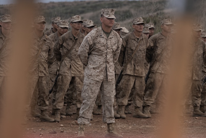 U.S. Marine Corps Sgt. Fernando Anzaldua, drill instructor with Bravo Company, 1st Recruit Training Battalion, stands in formation with his platoon during the Eagle, Globe, and Anchor Ceremony at Marine Corps Base Camp Pendleton, Calif., Sept. 20, 2023. After completing the Reaper hike, a ceremony is held where drill instructors present their new Marines with the Eagle, Globe, and Anchor. Anzaldua is a native of Escondido, Calif. (U.S. Marine Corps photo by Lance Cpl. Janell B. Alvarez)