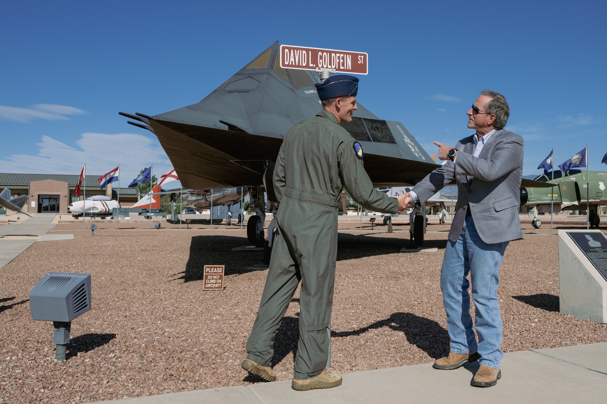 A street on Holloman Air Force Base is renamed to David L. Goldfein St at Holloman Air Force Base, New Mexico, Sept. 22, 2023. In June of 2006, Goldfein assumed command of the 49th Fighter Wing, which members of the current 49th Wing have decided to commemorate by naming a street in his honor. (U.S. Air Force photo by Senior Airman Antonio Salfran)