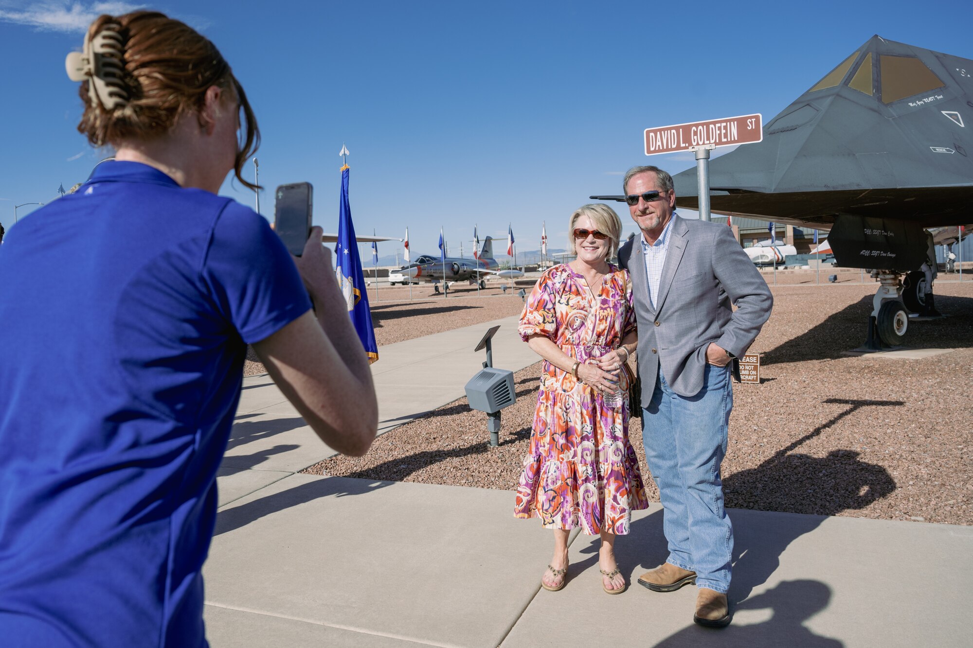 Retired U.S. Air Force Gen. David L. Goldfein, right, and his wife, Dawn, pose for a photo during a street renaming ceremony at Holloman Air Force Base, New Mexico, Sept. 22, 2023. A street here was renamed to honor the 21st Chief of Staff of the U.S. Air Force and previous Holloman commander, U.S. Air Force Gen. David L. Goldfein. (U.S. Air Force photo by Senior Airman Antonio Salfran)