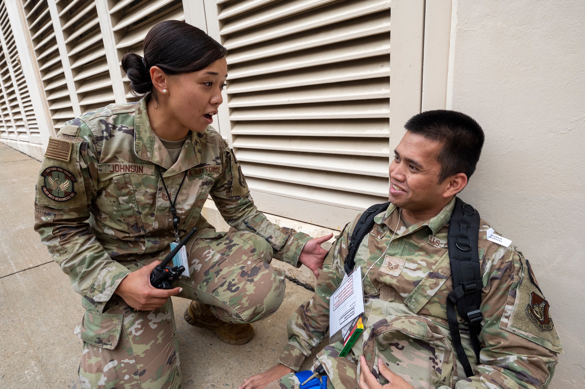 U.S. Air Force Tech. Sgt. Mariel Johnson, 51st Operational Medical Readiness Squadron physical therapy noncommissioned officer in charge, triages a simulated patient during a mass casualty training event at Osan Air Base, Republic of Korea, Sept. 21, 2023. Routine multi-agency training events like this help identify areas where existing policies and procedures may need refinement or improvement, allowing the 51st Fighter Wing to continuously develop and enhance emergency response protocols. (U.S. Air Force photo by Senior Airman Aaron Edwards)