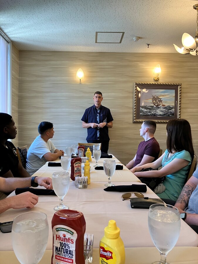 Major Brad Hull, executive officer of Combined Arms Training Center, Camp Fuji Japan, delivers a lecture before he and his audience visit the historical Japanese memorial Mikasa warship, September 13, 2023. (U.S. Marine Corps photo by Song Jordan)