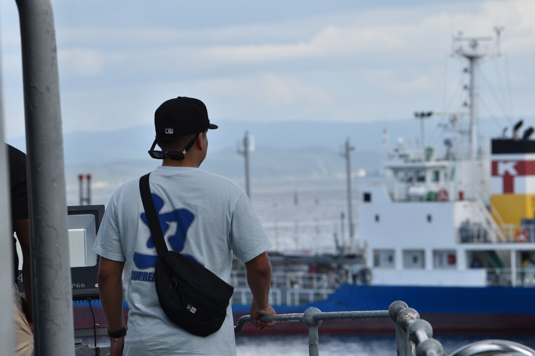 1st Lieutenant Francisco Mendoza looks at the view from the starboard side of the historical Japanese memorial Mikasa warship.