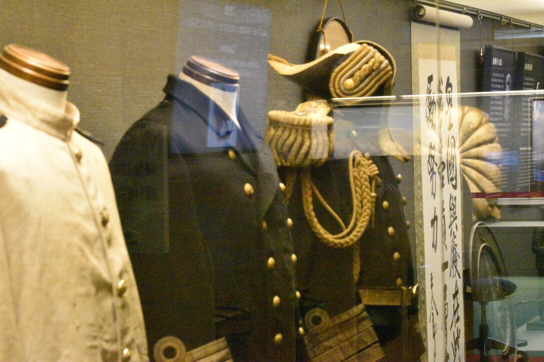 Several uniforms are on display at the historical Japanese memorial Mikasa warship.