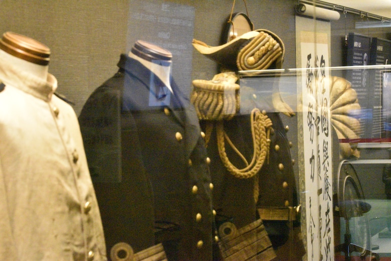 Several uniforms are on display at the historical Japanese memorial Mikasa warship.