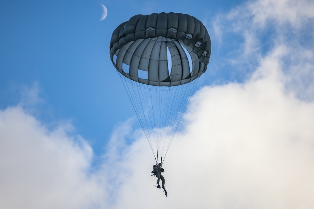 U.S. Marine Corps Sgt. Alan Elder conducts a low-level static line parachute jump on Marine Corps Base Hawaii, Sept. 20, 2023. The purpose of this training is for 3d Reconnaissance Marines to be able to support 3d Marine Littoral Regiment by inserting into key maritime terrain at a moment’s notice. Elder is an assistant team leader with 3d Reconnaissance Battalion, 3d Marine Division, and is a native of Springfield, Mo.