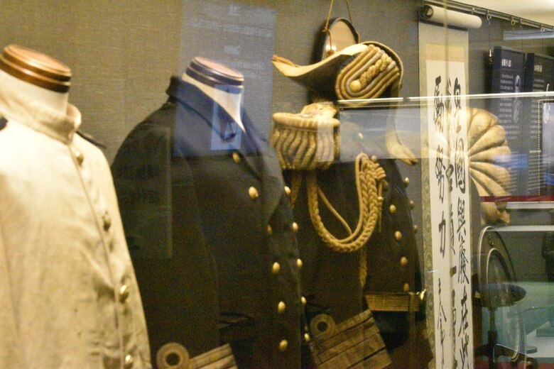 Several uniforms are on display at the historical Japanese memorial Mikasa warship.