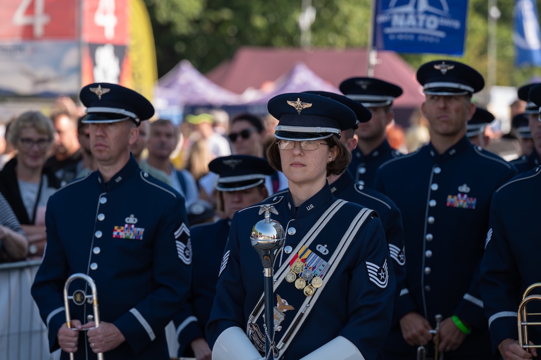 U.S. Air Force Tech. Sgt. Sara Garing, right, U.S. Air Forces in Europe Ceremonial Band drum major, prepares to command the band during the opening ceremony of the NATO Days event at Leoš Janáček Airport in Ostrava, Czech Republic, Sept. 16, 2023. The event was originally a regional public presentation of armed forces, police, and rescuers, but has since evolved into the largest air, military and security show in Central Europe. (U.S. Air Force photo by Airman 1st Class Christopher Campbell)