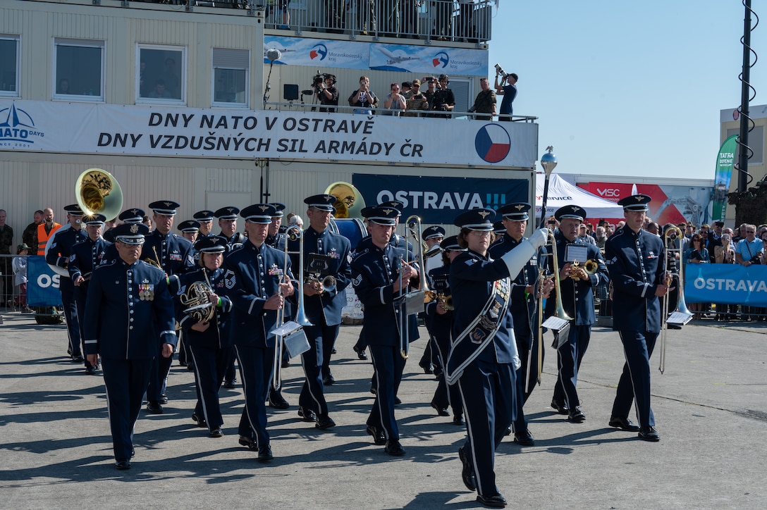 U.S. Air Force Airmen assigned to the U.S. Air Forces in Europe Ceremonial Band, march during the opening ceremony of the NATO Days event at Leoš Janáček Airport in Ostrava, Czech Republic, Sept. 16, 2023. The event was originally a regional public presentation of armed forces, police, and rescuers, but has since evolved into the largest air, military and security show in Central Europe. (U.S. Air Force photo by Airman 1st Class Christopher Campbell)