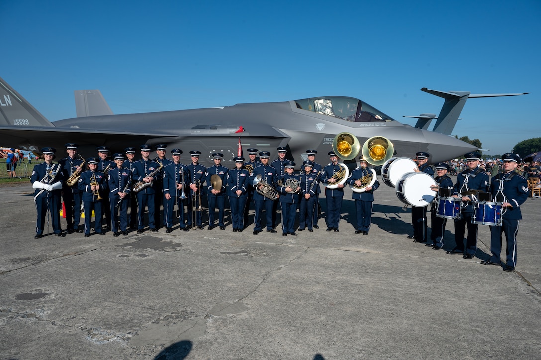 U.S. Air Force Airmen assigned to the U.S. Air Forces in Europe Ceremonial Band, stand together in front of F-35A Lightning II aircraft from the 48th Fighter Wing, Royal Air Force Lakenheath, England, during the NATO Days event at Leoš Janáček Airport in Ostrava, Czech Republic, Sept. 16, 2023. The USAFE Band traveled to multiple cities in the Czech Republic Sept. 14 to 17, to showcase the U.S. commitment to NATO allies in the European area of responsibility. (U.S. Air Force photo by Airman 1st Class Christopher Campbell)