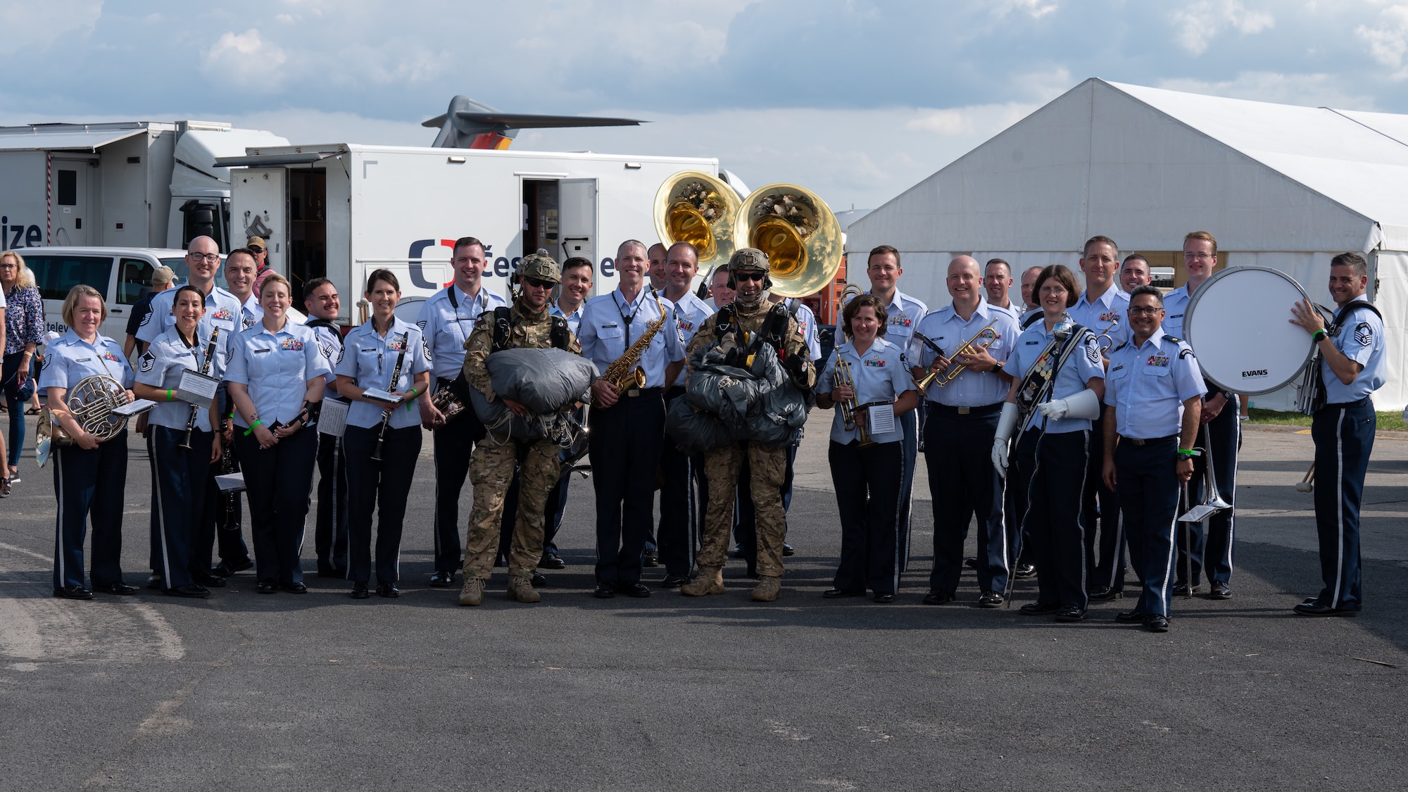 U.S. Air Force Airmen assigned to the U.S. Air Forces in Europe Ceremonial Band, and Polish military special forces parachutists, pose for a group photo during the NATO Days event at Leoš Janáček Airport in Ostrava, Czech Republic, Sept. 17, 2023.