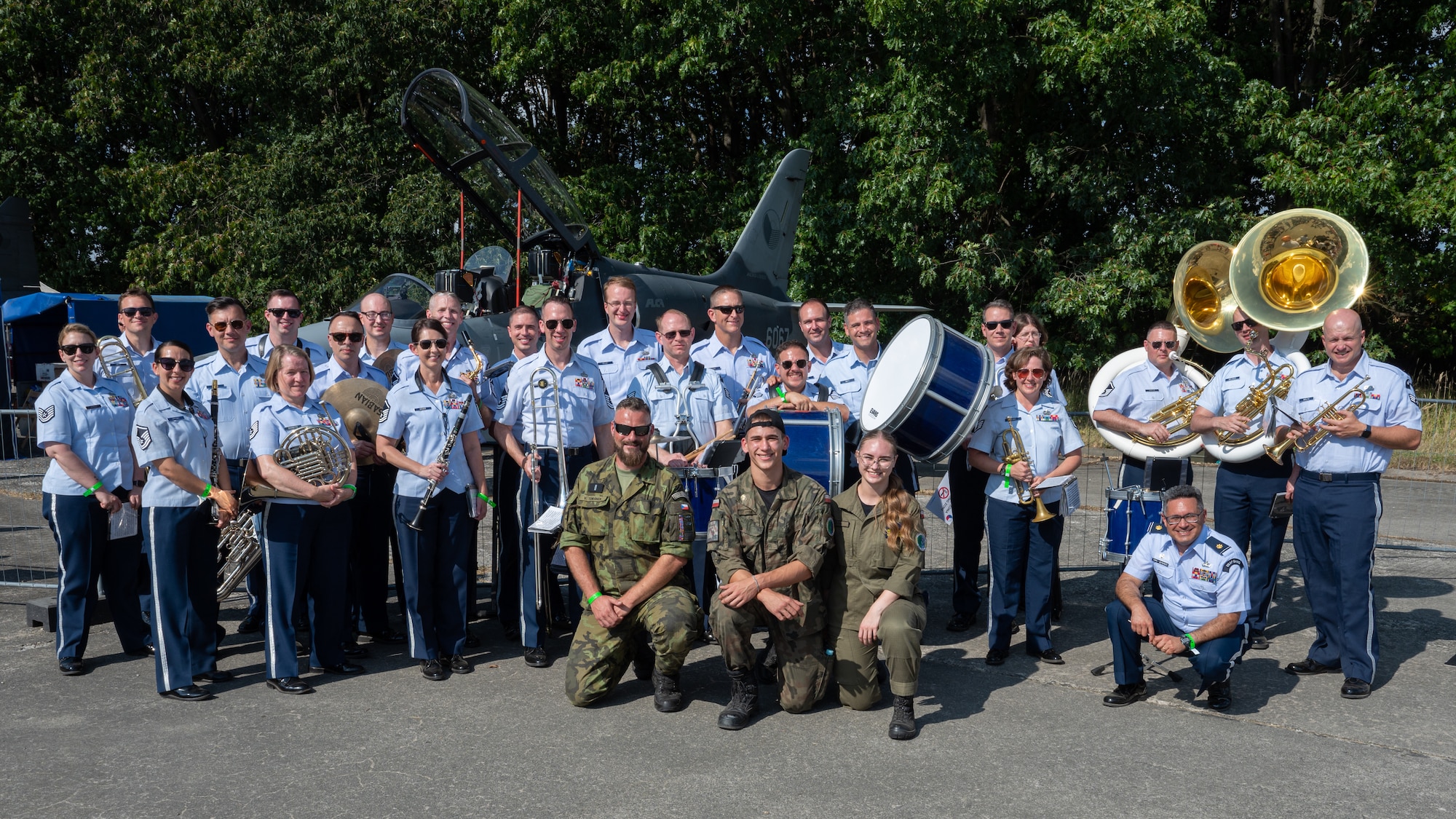 U.S. Air Force Airmen assigned to the U.S. Air Forces in Europe Ceremonial Band, and members of the Polish and Czech military, pose for a group photo during the NATO Days event at Leoš Janáček Airport in Ostrava, Czech Republic, Sept. 17, 2023.