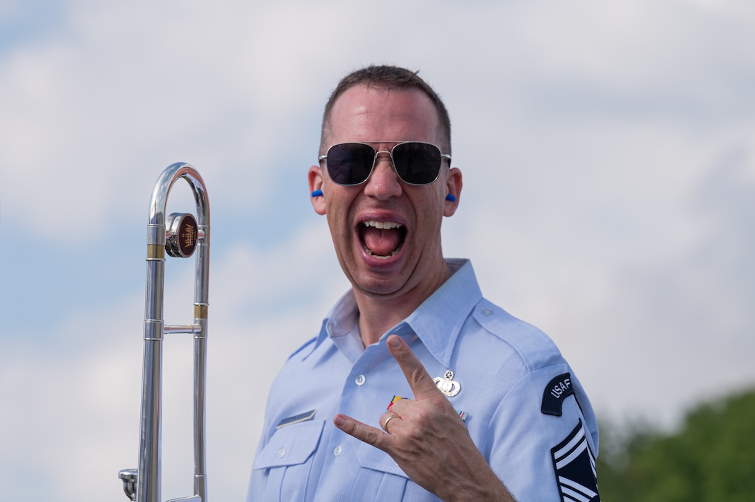 U.S. Air Force Senior Master Sgt. Ben Kadow, U.S. Air Forces in Europe Ceremonial Band trombonist, smiles after finishing a song during the NATO Days event at Leoš Janáček Airport in Ostrava, Czech Republic, Sept. 17, 2023. The USAFE Band serves as a bridge to increase cultural ties and enrich the partnerships between the U.S. and Czech Republic through music. (U.S. Air Force photo by Airman 1st Class Christopher Campbell)