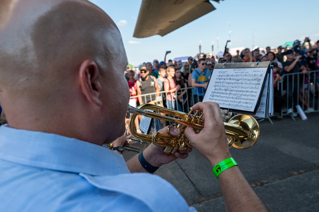 U.S. Air Force Staff. Sgt. John Merlitz, U.S. Air Forces in Europe Ceremonial Band trumpeter, performs during the NATO Days event at Leoš Janáček Airport in Ostrava, Czech Republic, Sept. 16, 2023. The event was originally a regional public presentation of armed forces, police, and rescuers, but has since evolved into the largest air, military and security show in Central Europe. (U.S. Air Force photo by Airman 1st Class Christopher Campbell)