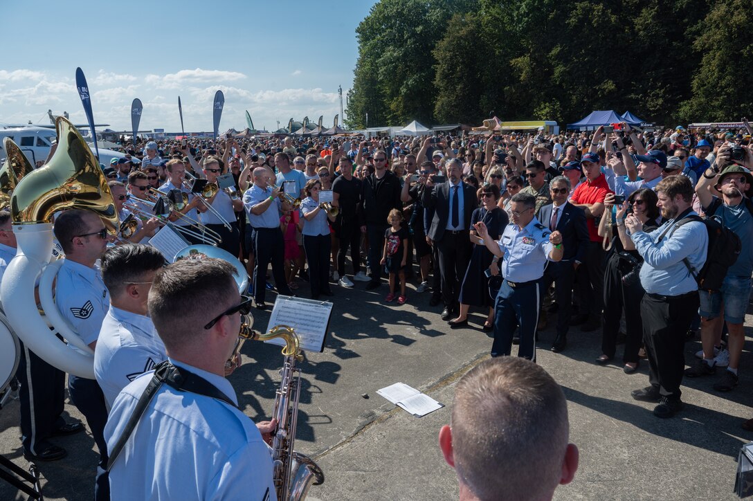 U.S. Air Force Airmen assigned to the U.S. Air Forces in Europe Ceremonial Band, perform during the NATO Days event at Leoš Janáček Airport in Ostrava, Czech Republic, Sept. 16, 2023. The event was originally a regional public presentation of armed forces, police, and rescuers, but has since evolved into the largest air, military and security show in Central Europe. (U.S. Air Force photo by Airman 1st Class Christopher Campbell)