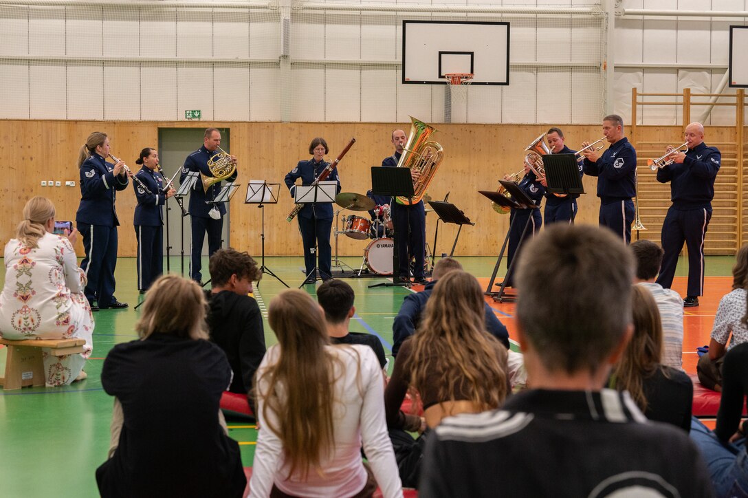 U.S. Air Force Airmen assigned to the U.S. Air Forces in Europe Band perform for students at Silesian Grammar School Opava in Opava, Czech Republic, Sept. 14, 2023. The USAFE Band traveled to multiple cities in the Czech Republic, Sept. 14 to 17, to showcase the U.S. commitment to NATO allies in the European area of responsibility. (U.S. Air Force photo by Airman 1st Class Christopher Campbell)
