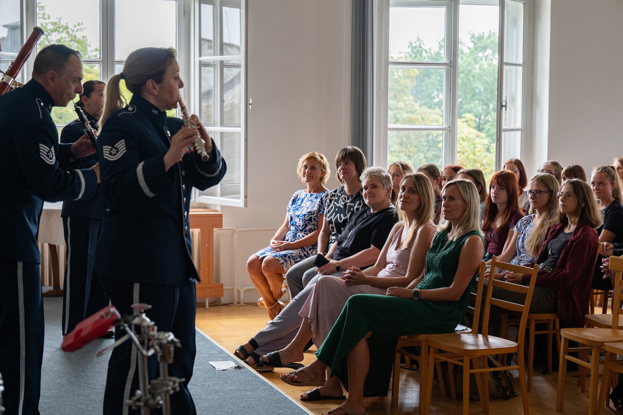 U.S. Air Force Airmen assigned to the U.S. Air Forces in Europe Band’s Winds Aloft Woodwind Quintet perform for students at the Secondary School of Nursing in Opava, Czech Republic, Sept. 14, 2023.
