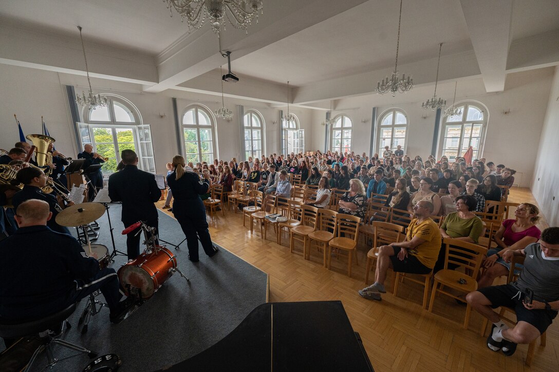 Czech students watch the U.S. Air Forces in Europe Band perform at the Secondary School of Nursing in Opava, Czech Republic, Sept. 14, 2023. After the USAFE Band’s performance, professors provided the band a tour of the school and historical landmarks in Opava. (U.S. Air Force photo by Airman 1st Class Christopher Campbell)