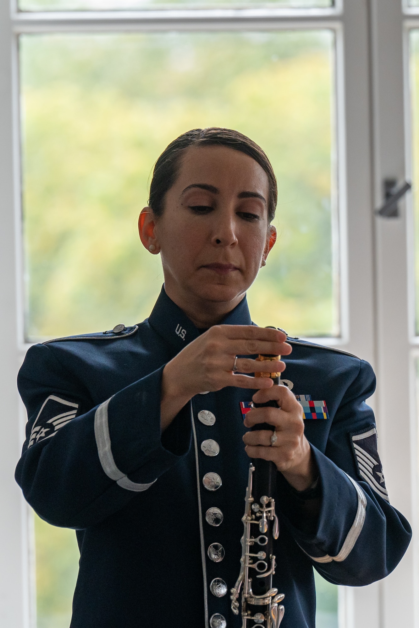 U.S. Air Force Master Sgt. Jennifer Daffinee, U.S. Air Forces in Europe Band’s Winds Aloft Woodwind Quintet clarinetist, prepares for a performance at the Secondary School of Nursing in Opava, Czech Republic, Sept. 14, 2023.