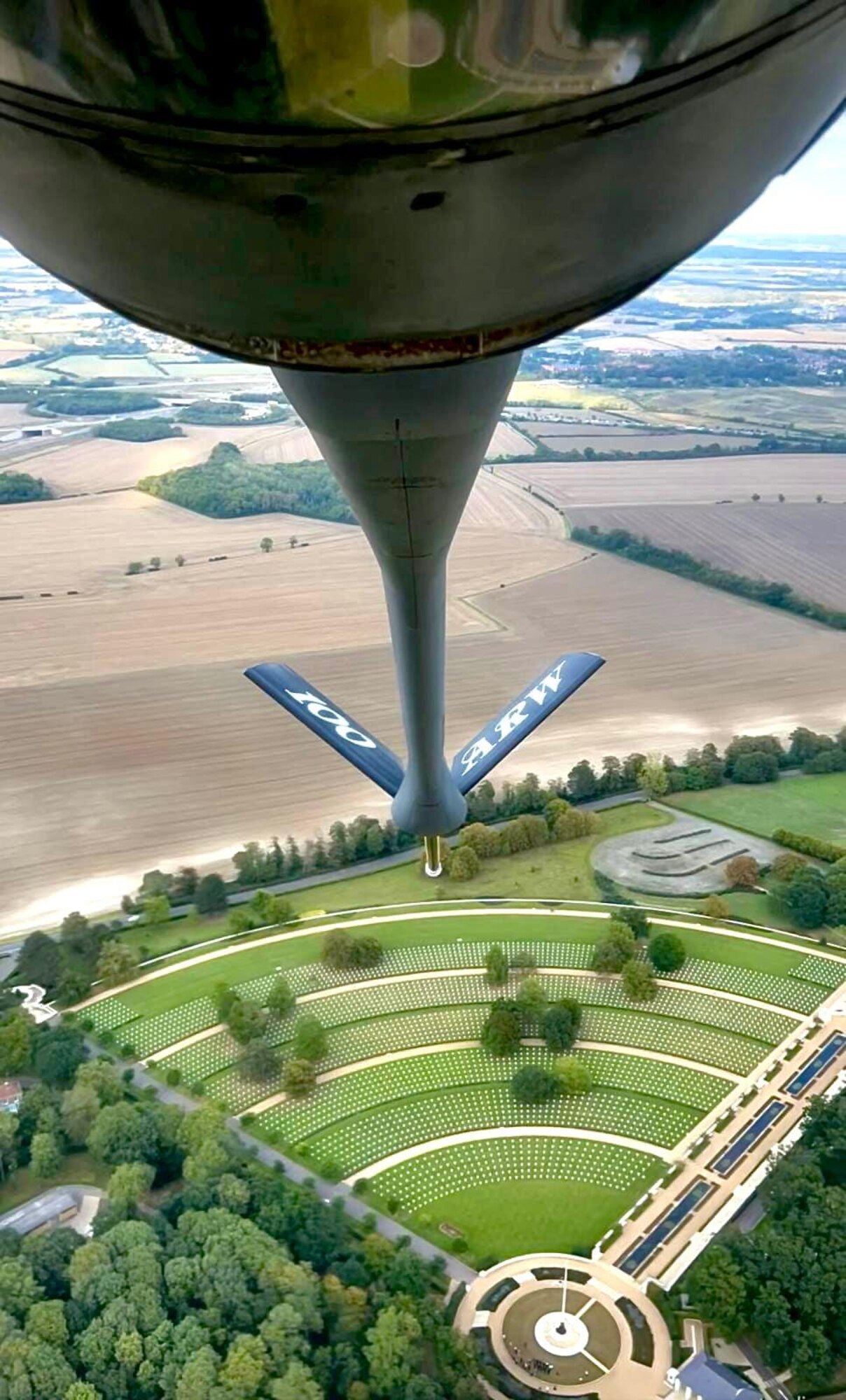 The view of Madingley American Cemetery can be seen from the boom pod of a KC-135 Stratotanker from the 100th Air Refueling Wing as aircrew from the 351st Air Refueling Squadron performs a flyover at the cemetery, Cambridgeshire, England, Sept. 15, 2023. There are 3,811 memorials and 5,127 names recorded on the Walls of the Missing, remembering and honoring those who sacrificed their lives for their country while serving overseas. (Courtesy photo by Senior Airman Jordan Carr)
