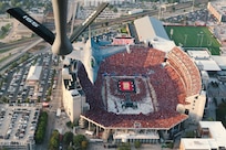 A KC-135R Stratotanker assigned to the 155th Air Refueling Wing along with an F-16 from the 114th Fighter Wing fly over over Memorial Stadium, Lincoln, Nebraska, Aug. 30, 2023, for a University of Nebraska volleyball game. The flyover celebrated Volleyball Day in Nebraska, where 92,003 fans became the largest crowd in the world to witness a women’s sporting event.