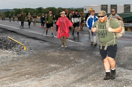 The Pennsylvania National Guard and the USO hosted the 12th Annual March for the Fallen at Stricker Field, Fort Indiantown Gap, Pa., Sept. 23. Conducted annually, March for the Fallen is opportunity for military and civilian communities to come together and honor the memory of fallen service members who made the ultimate sacrifice in defense of this great nation. This year more than 300 marchers braved strong winds and heavy rains from Tropical Storm Ophelia as they hit the course for multiple events – 28- and 14-mile marches, 5-kilometer run/walk, or a 28-mile hand cycle race. (Pennsylvania National Guard by Wayne V. Hall)