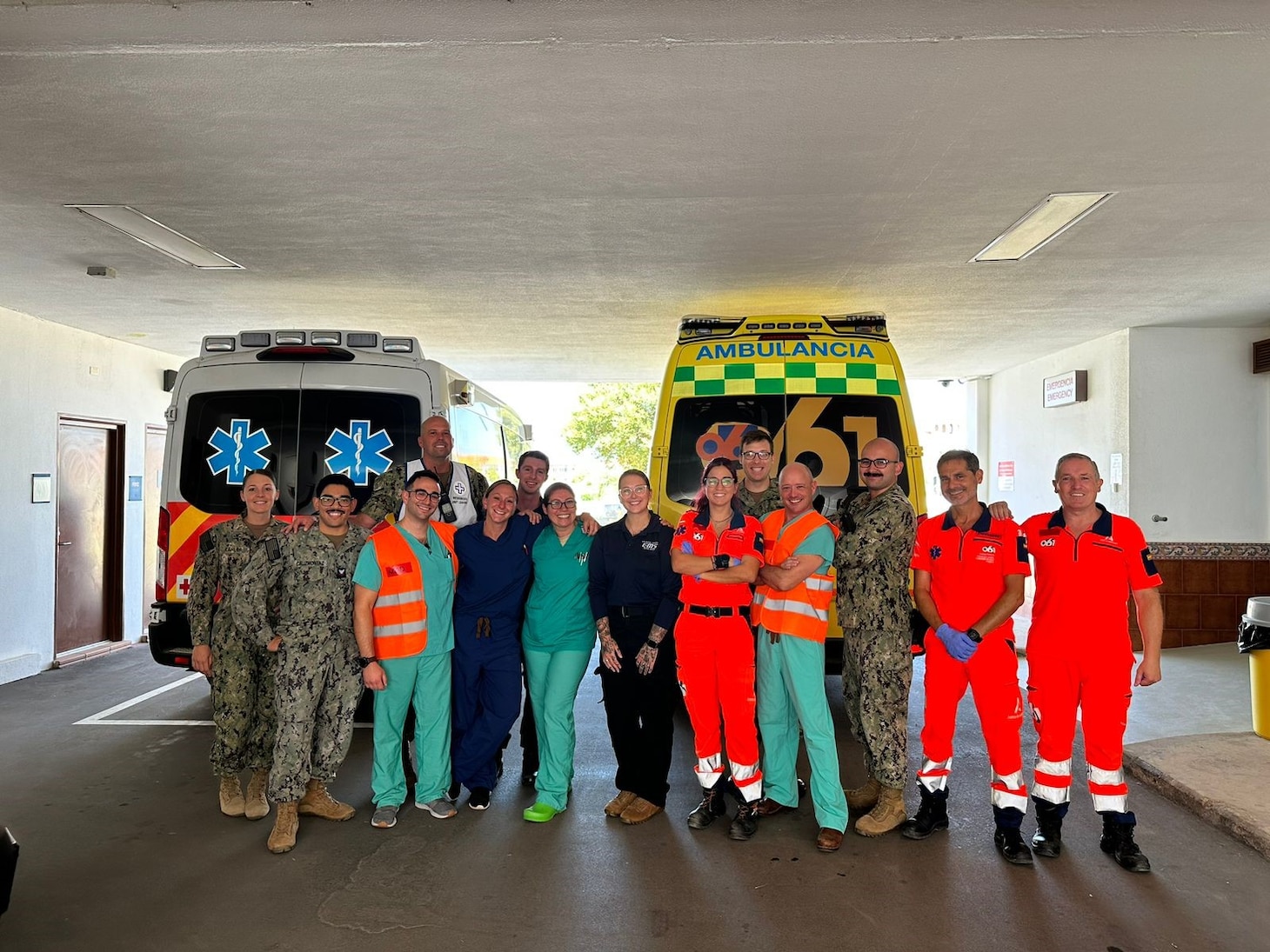 Members of Navy Medicine Readiness and Training Command Rota staff pose with emergency response partners from the Spanish 061 team during a mass casualty drill on August 22, 2023. Naval Hospital Rota is a forward deployed ready medical treatment facility protecting force health, sustaining medical readiness, and prepared to surge support for a major logistics base and joint tenants on demand by EUCOM, AFRICOM, and CENTCOM.